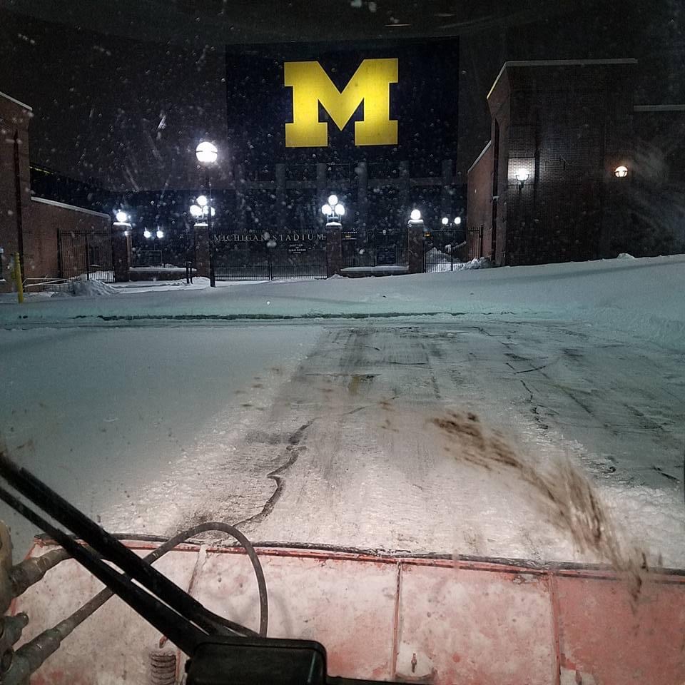 view of Michigan Stadium scoreboard from a snowplow 